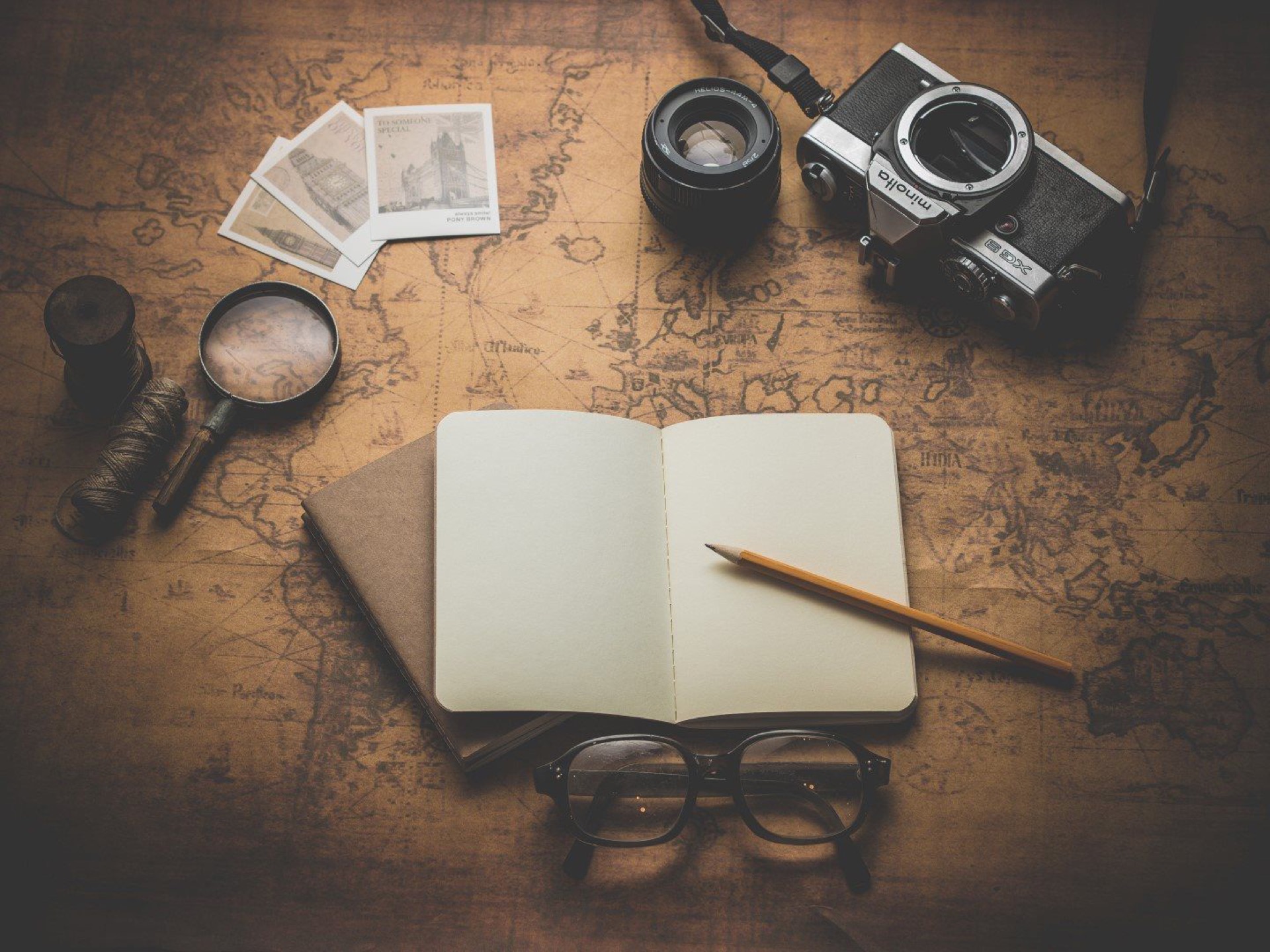 Map, camera and travel notebook
