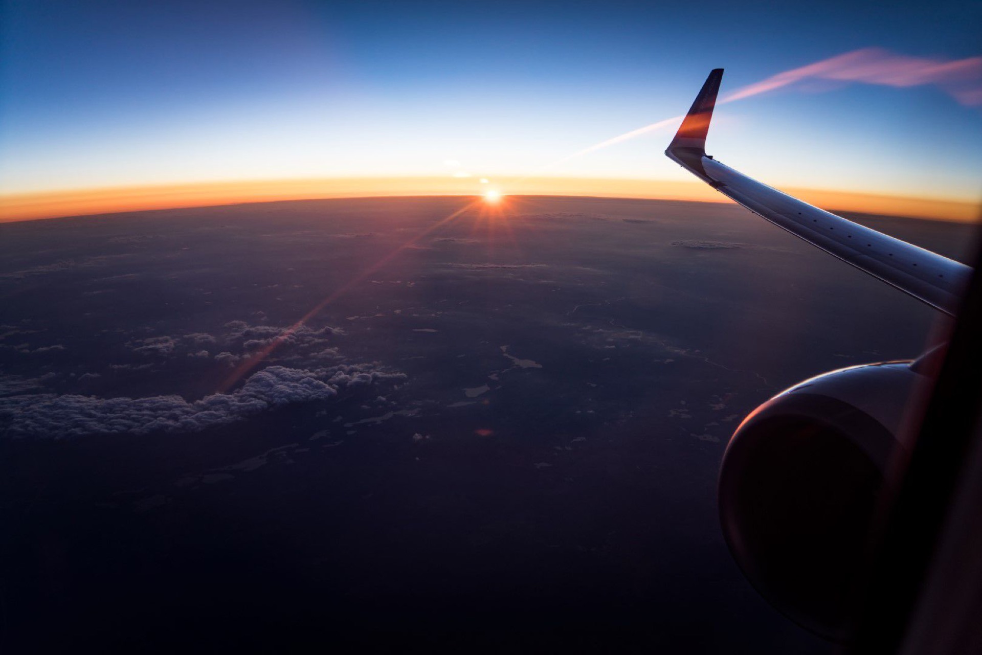 Airplane wing at dusk