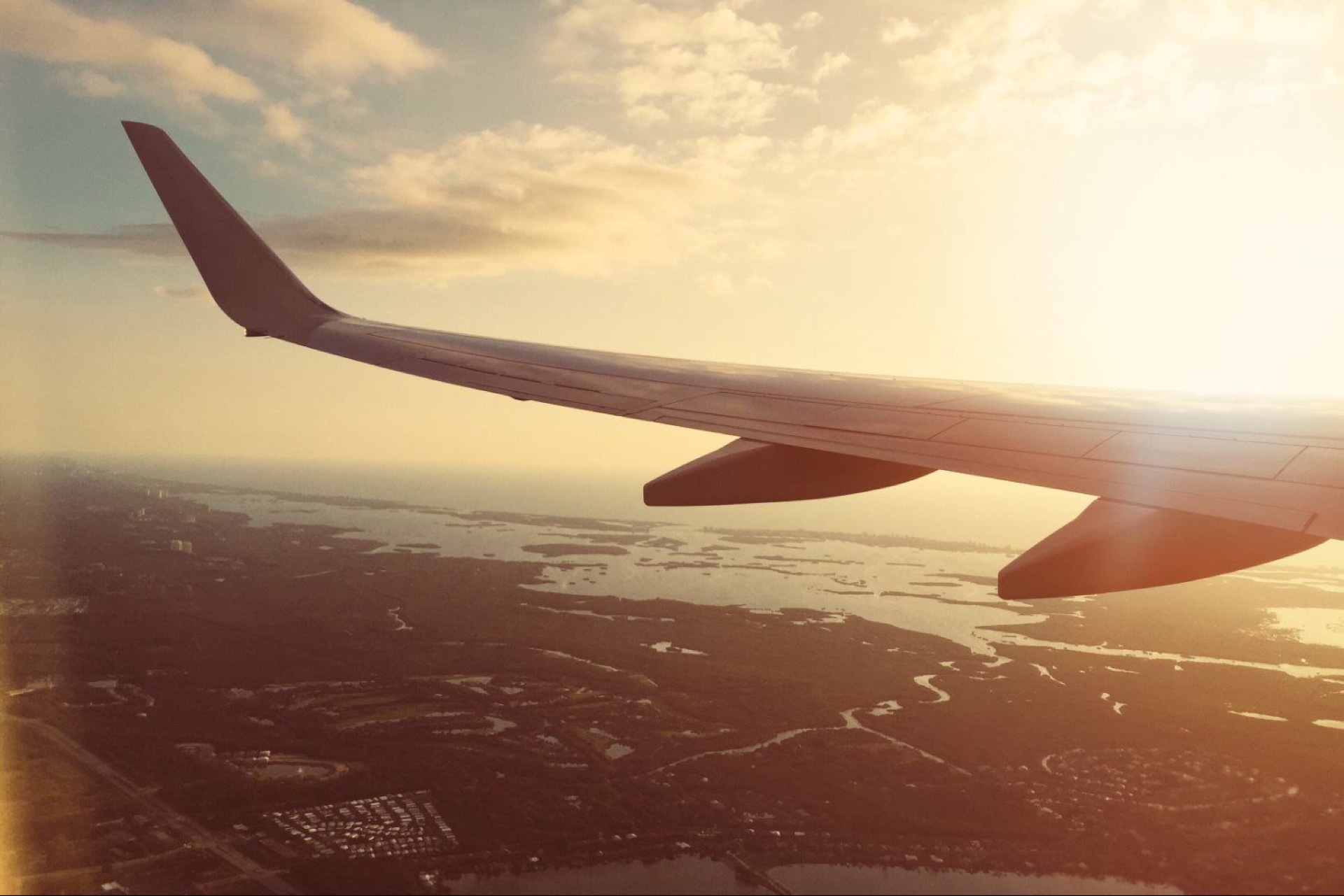 Airplane wing at sunset